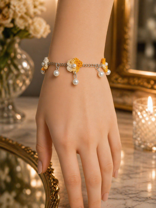 Orange floral crochet charm bracelet with pearl drop detailing