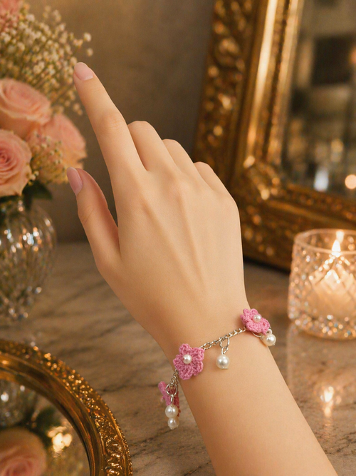 Pink crochet charm bracelet with pearl drop detailing