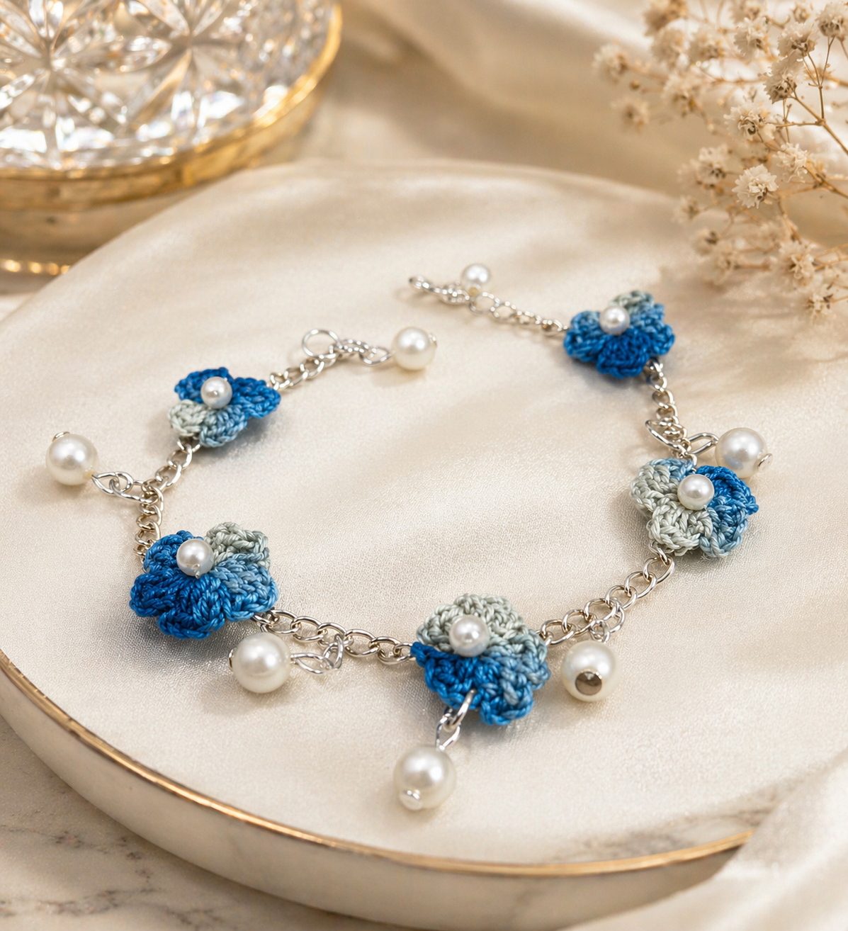 Blue crochet charm bracelet with pearl drop detailing