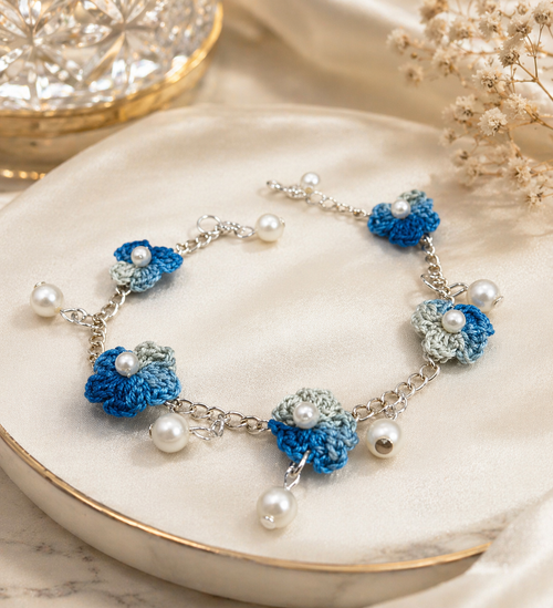 Blue crochet charm bracelet with pearl drop detailing