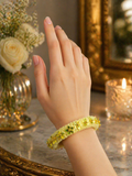 Yellow floral crochet bangle bracelet with bead detailing