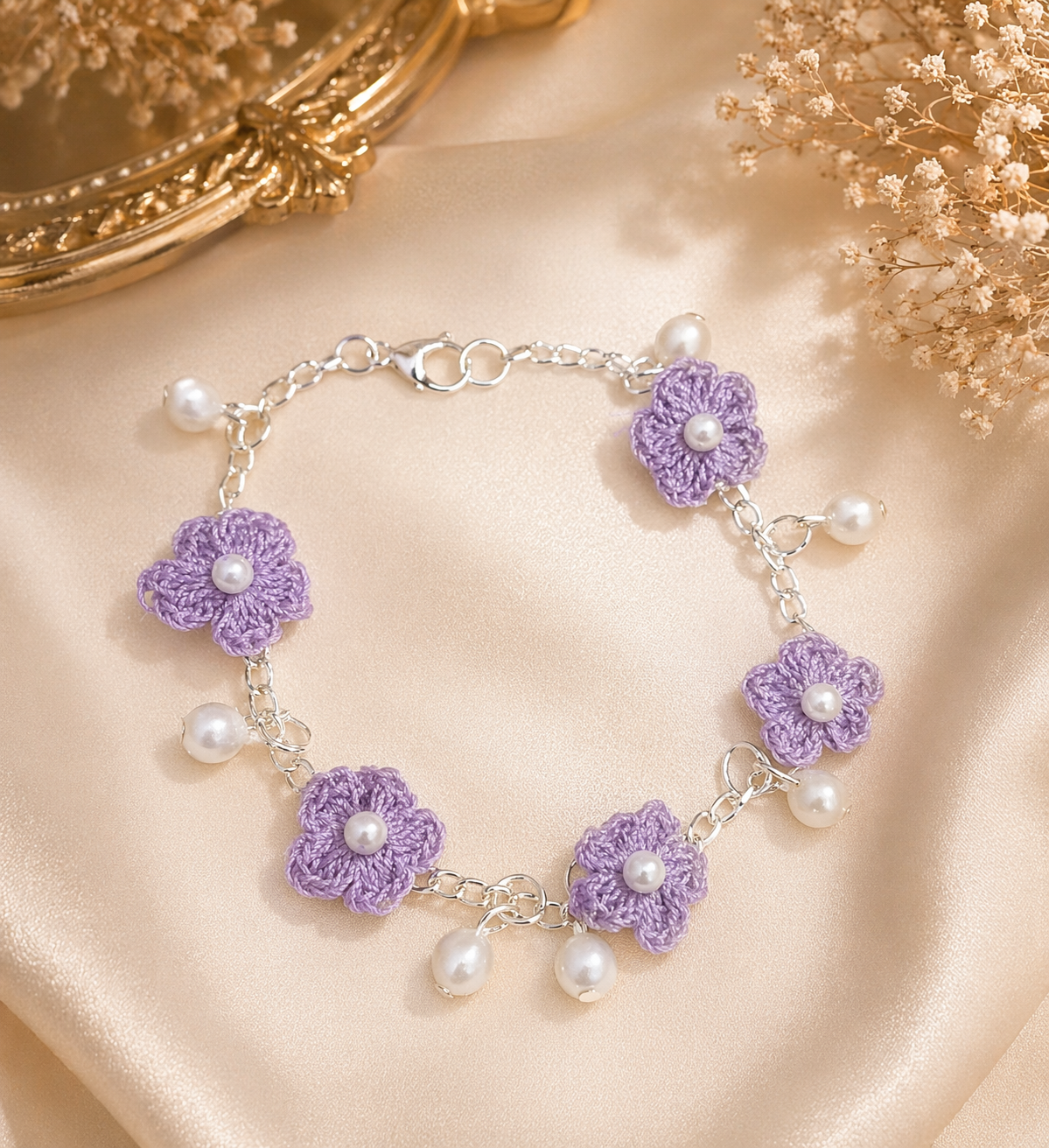 Close up of lavender crochet floral charm bracelet with pearl drops